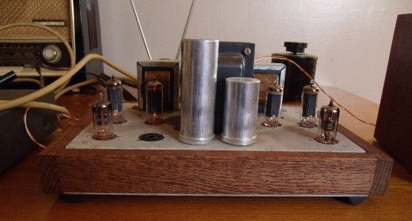 STEREO CONSOLE TUBE AMPLIFIER, WOOD TRIMMED AND RUNS GREAT MAGNAVOX 